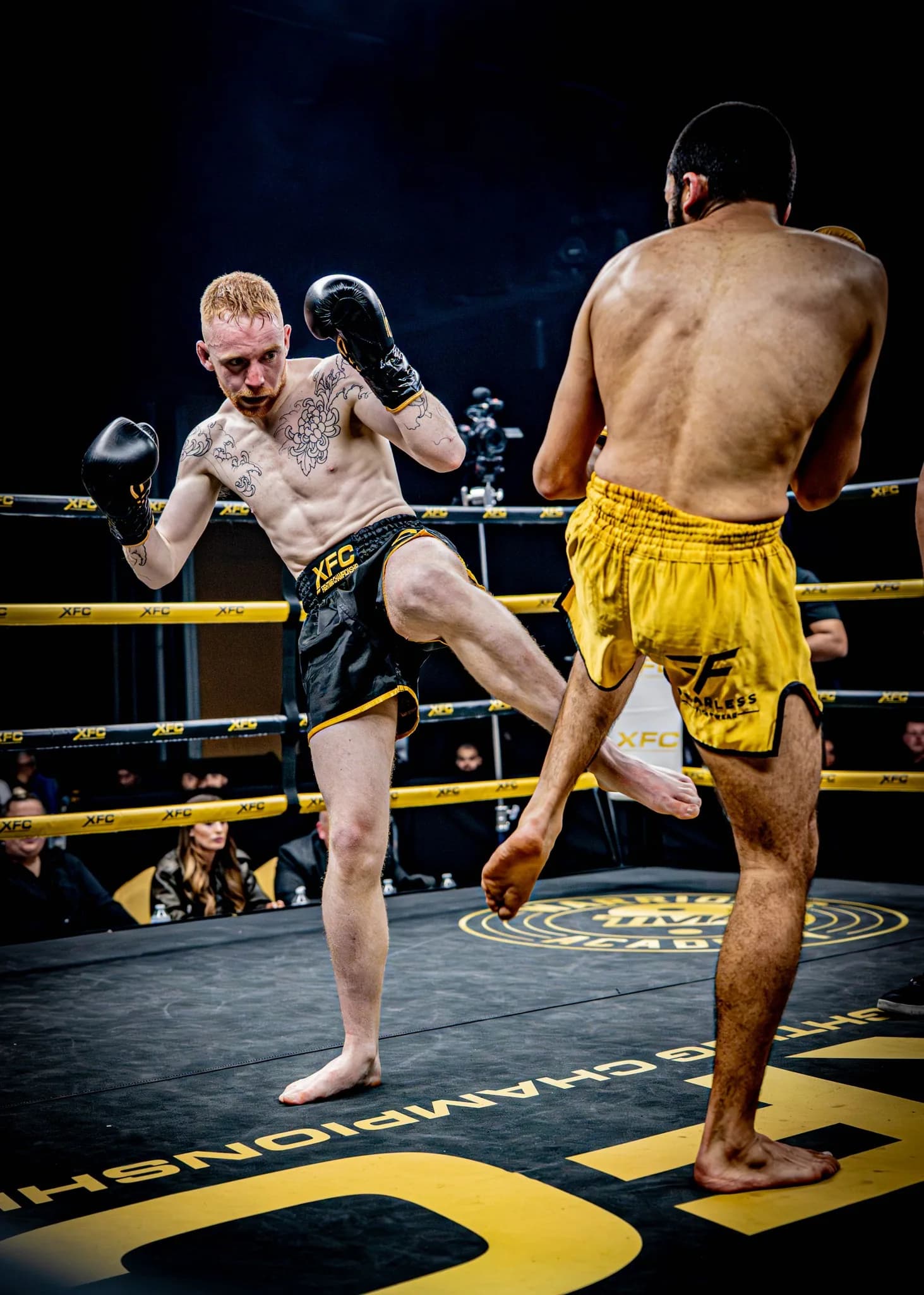 XFC shin-on-shin kick exchange captured from ringside.